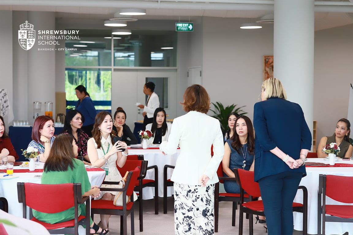 Shrewsbury parents engaging in bilingual education discussions at Hanqing HQ.