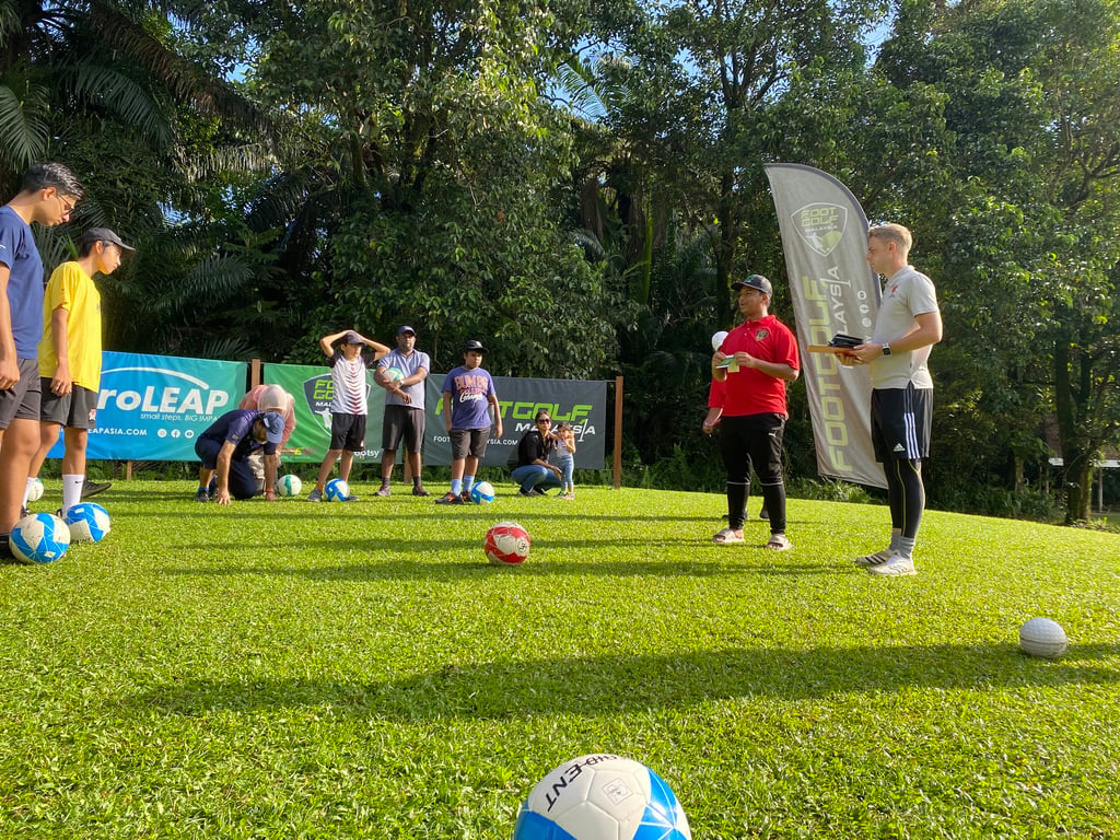 ELC students having a friendly Footgolf match with their parents.