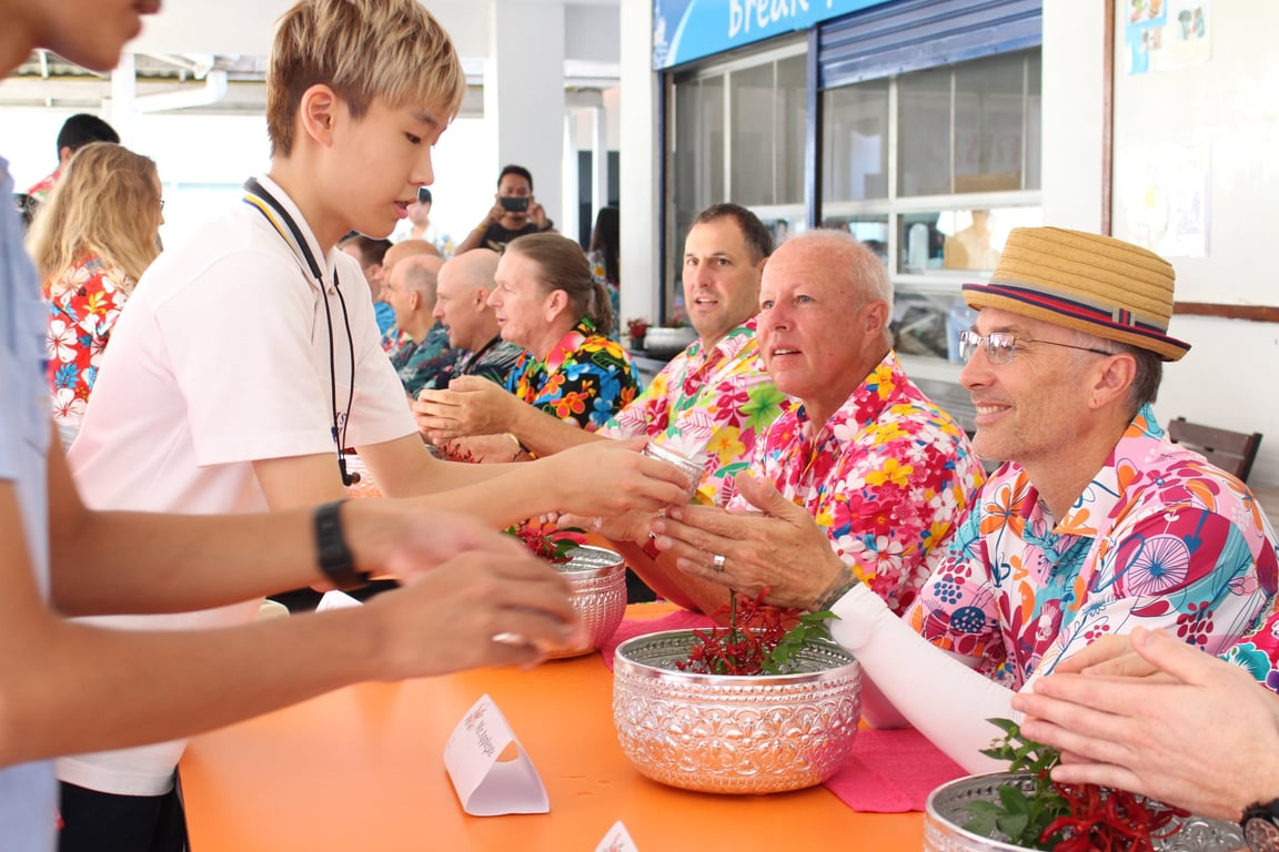 Teachers receiving water and well wishes during Songkran.