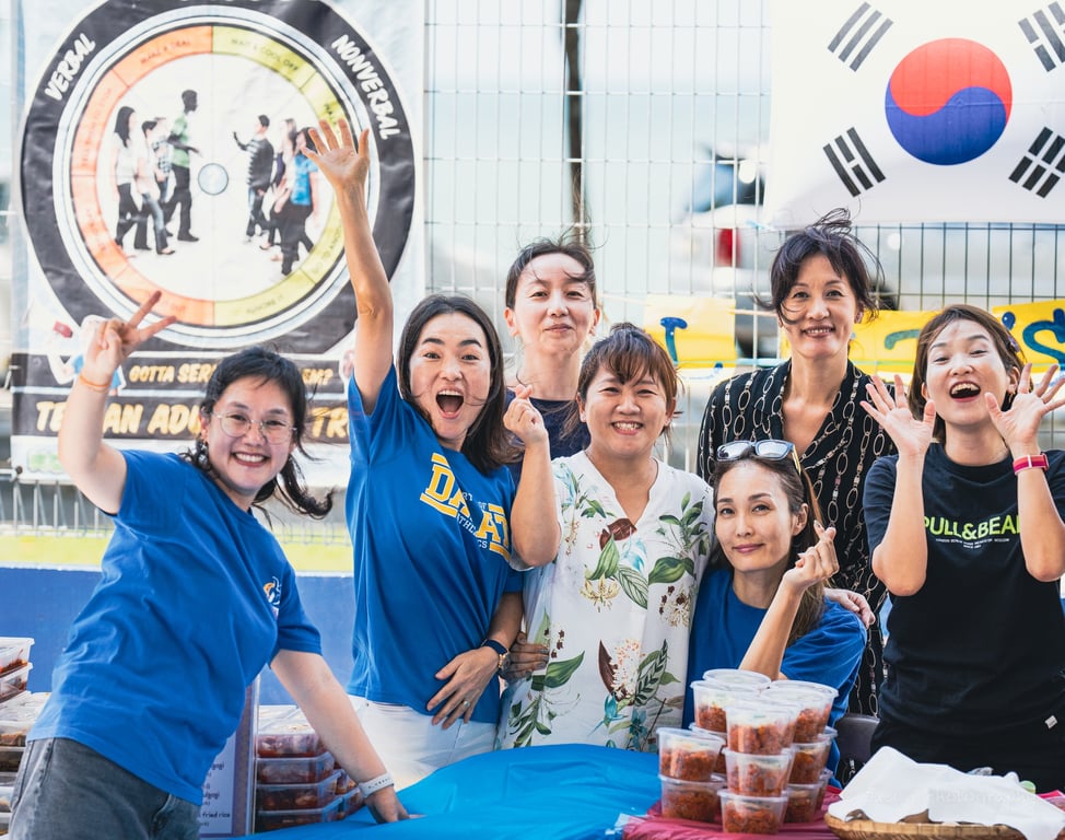 Korean parents volunteering in the food fair. 