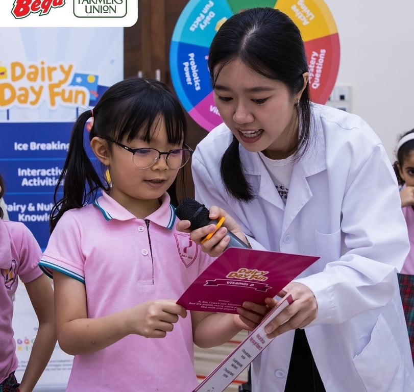 Student answering dairy knowledge questions at the workshop.