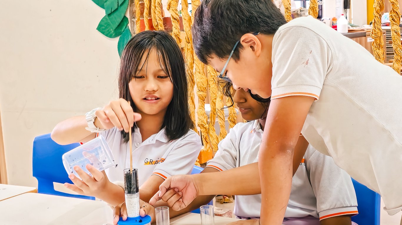 Students conduct STEM experiments, innovating on water filtration methods.