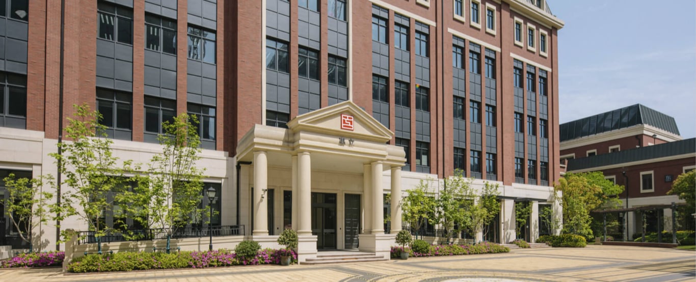 The main entrance and red brick facade of Hiba Academy Shanghai.