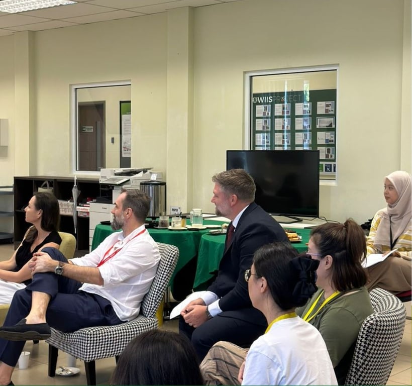 Parents and staff participate in the POWIIS Supporters Club event to enhance collaboration.