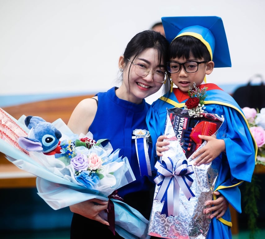 Parent celebrating with student at the Kinder Moving-Up Ceremony.