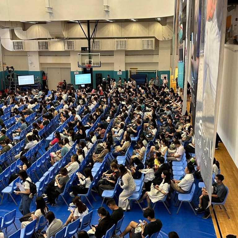 Parents and guardians gathered in the school gym for Grade 1 admissions interviews.