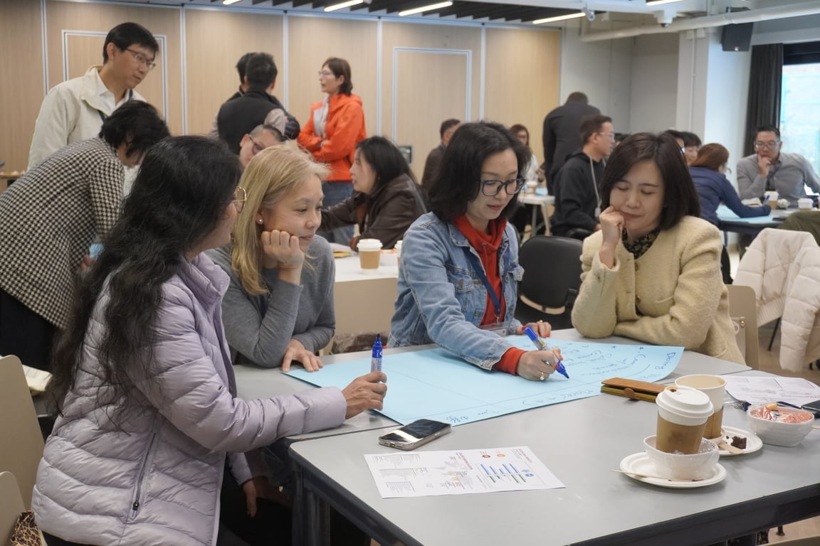 Parents attending a coffee morning session at Sha Tin college.