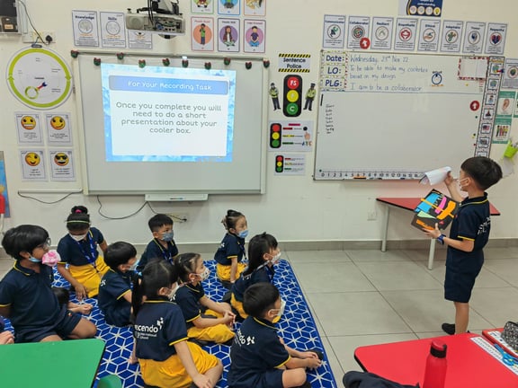 A young student presents his cooler box project during IPC class presentation in Early Years.