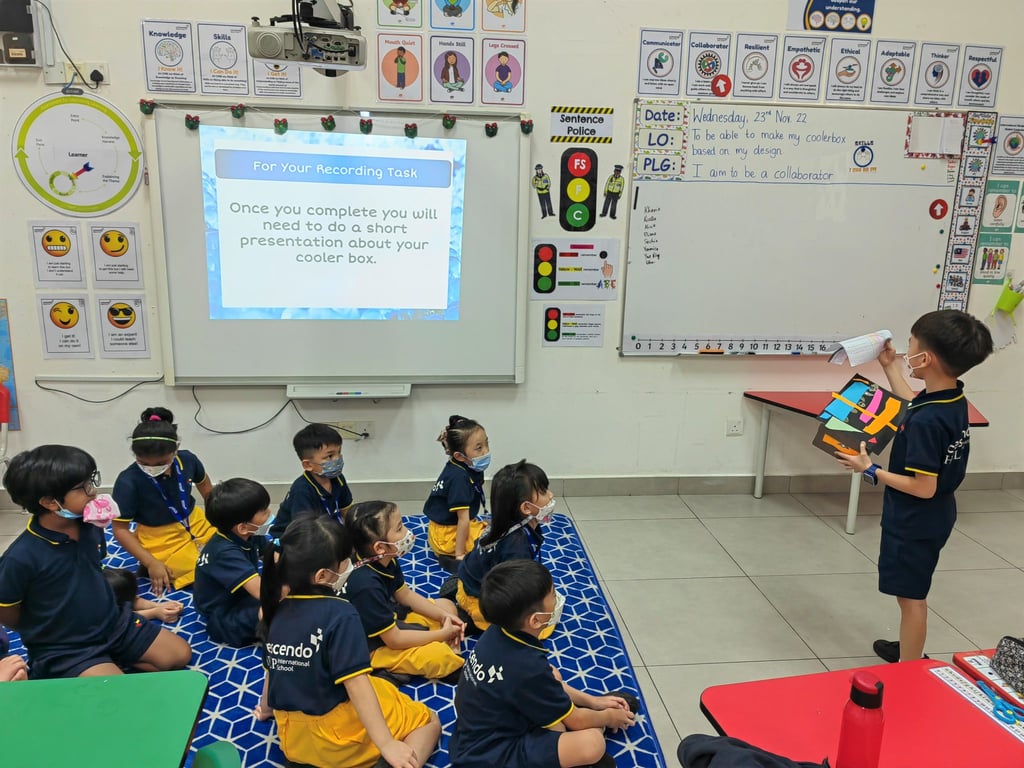 A young student presents his cooler box project during IPC class presentation in Early Years.