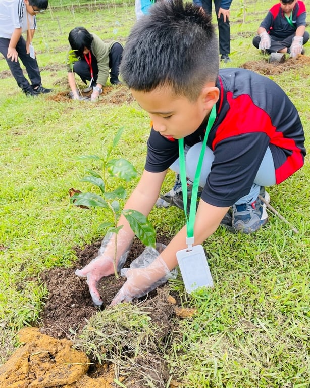 Primary 5 students got their hands dirty -literally - by planting their own Arabica coffee plants during their expedition to Medan, Indonesia