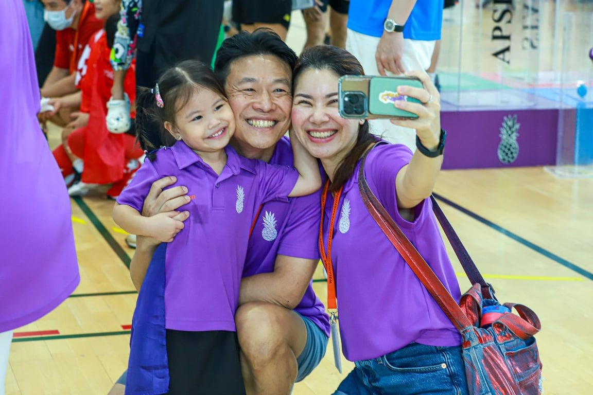 Family selfie moment at Superhero Sports Day.