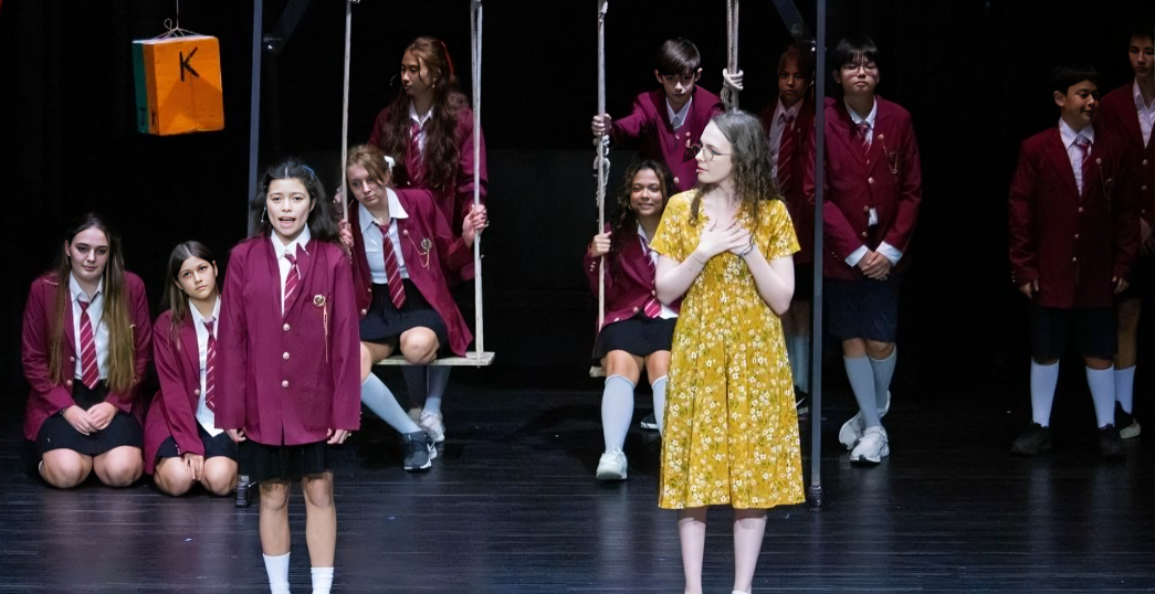Students showcase teamwork and creativity in a school theatre production.