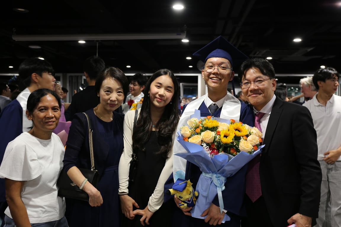 A family posing together at the Graduation Ceremony.