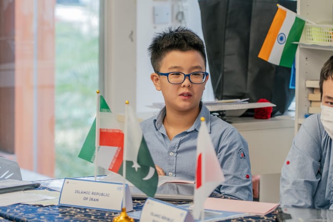 Grade 6 student representing a country during the Model United Nations conference.