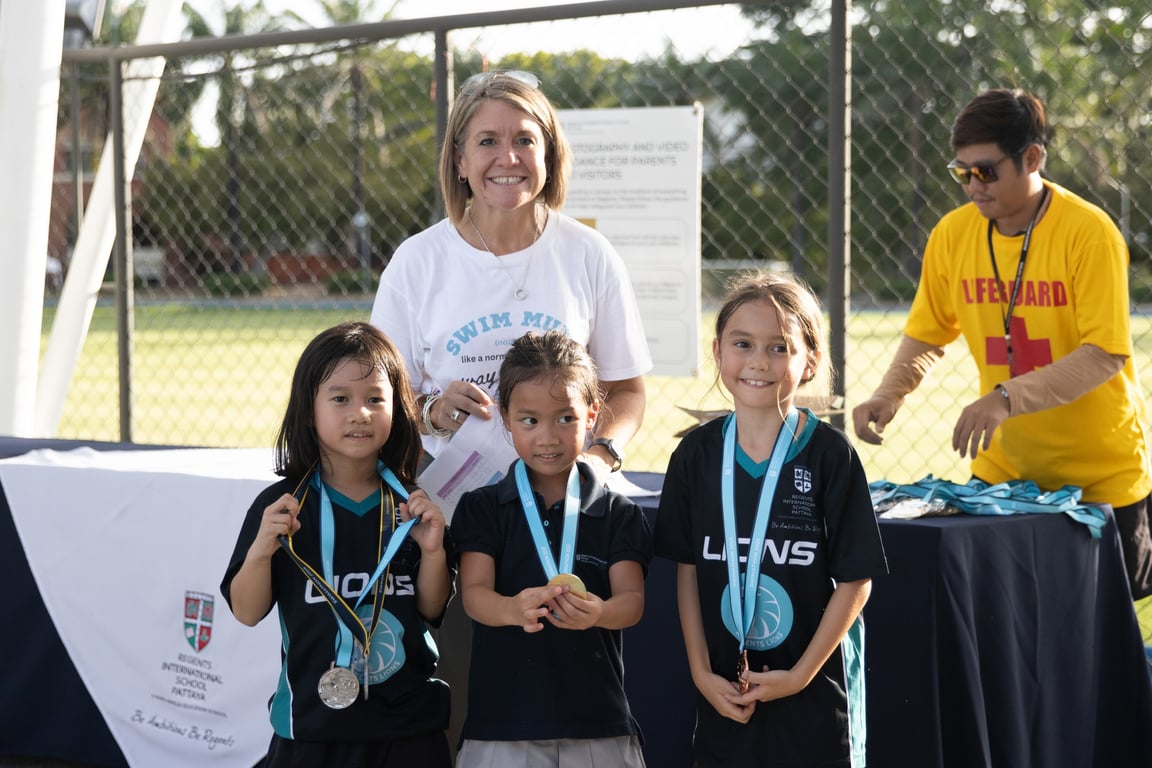 Young medalists posing after the Regents Swimathon 2025 award ceremony.