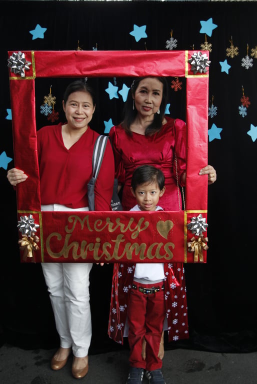 Parents and student at the school’s Christmas celebration.