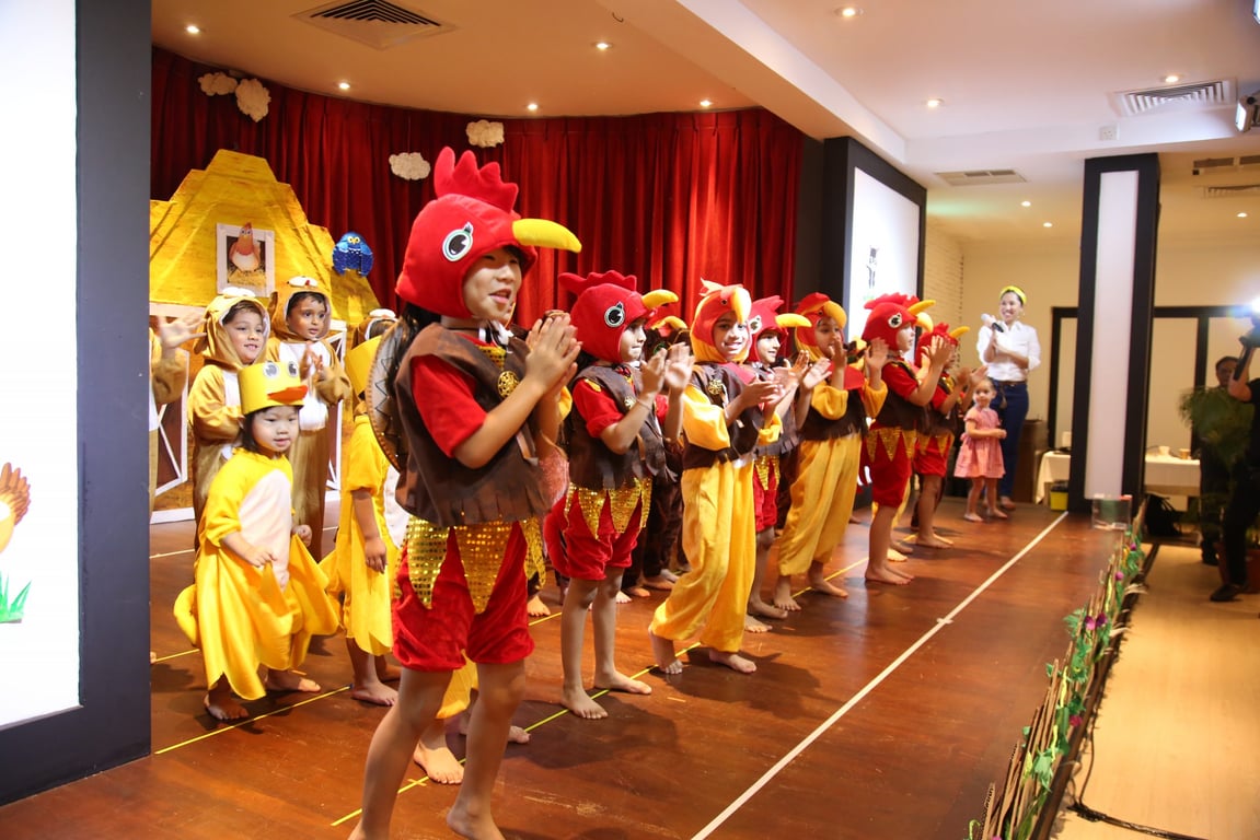 Young performers light up the stage in a lively chicken-themed play.