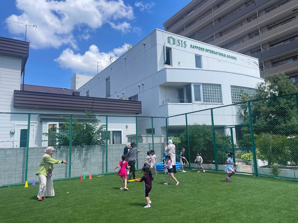 An exterior view of the Sapporo International School building and primary play area.