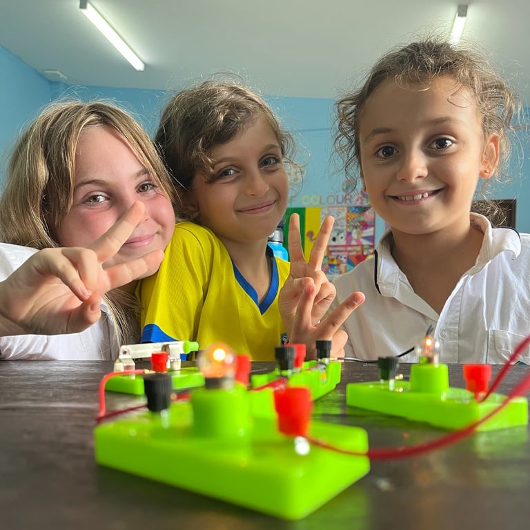 Primary students posing during science class.