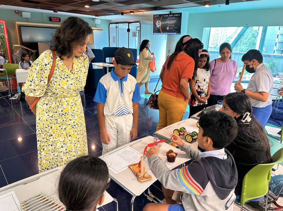 Children showcase their work during the Parent-Teacher Exhibition