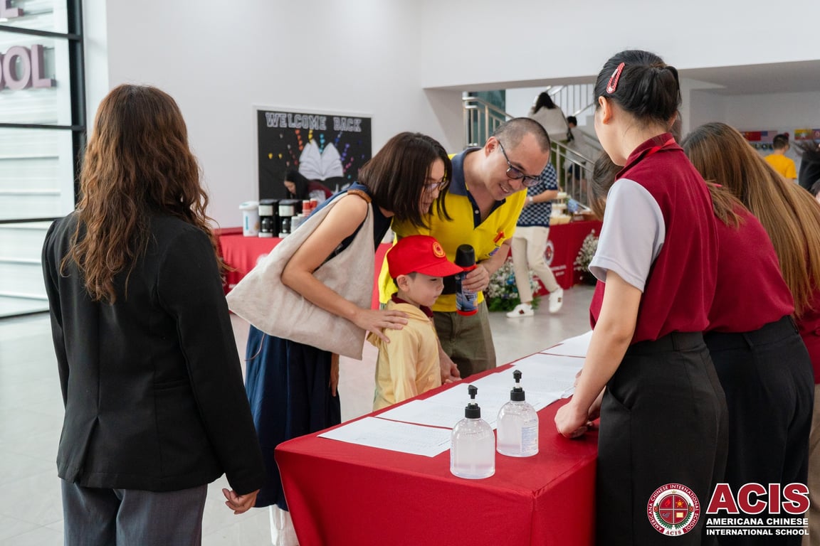 Families registering for parent orientation.