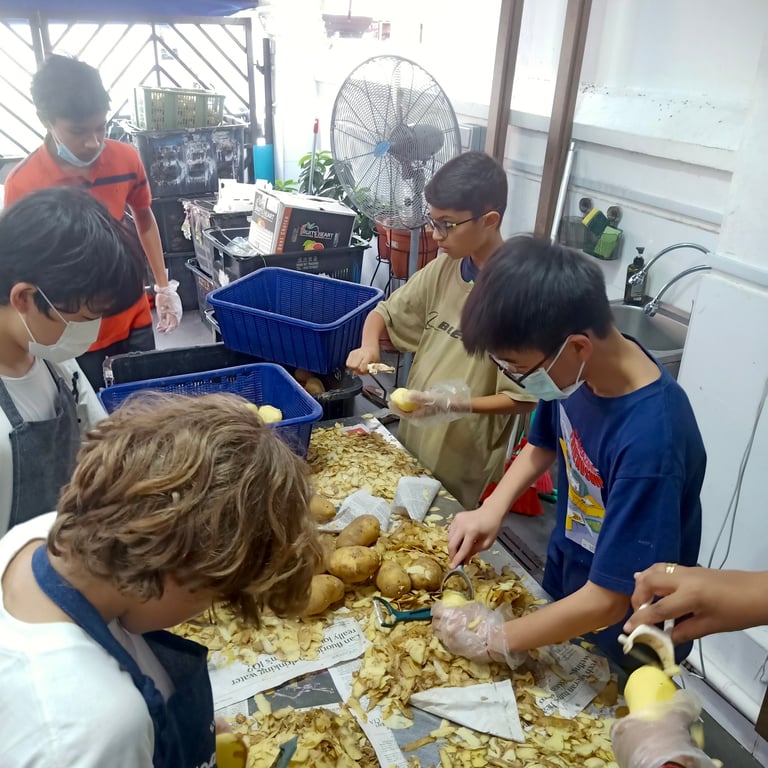 Secondary school NYAA student volunteers helping out at a local soup kitchen.