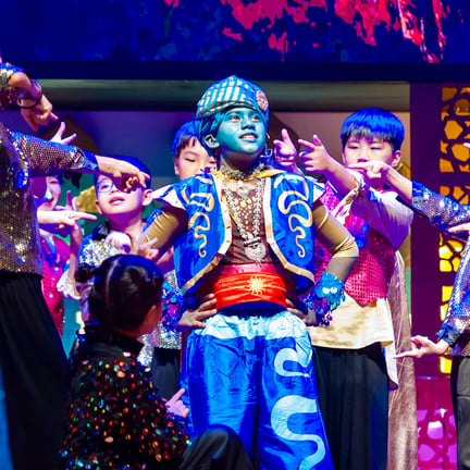 Students take to the stage during the theatrical performance of “A Whole New World”.