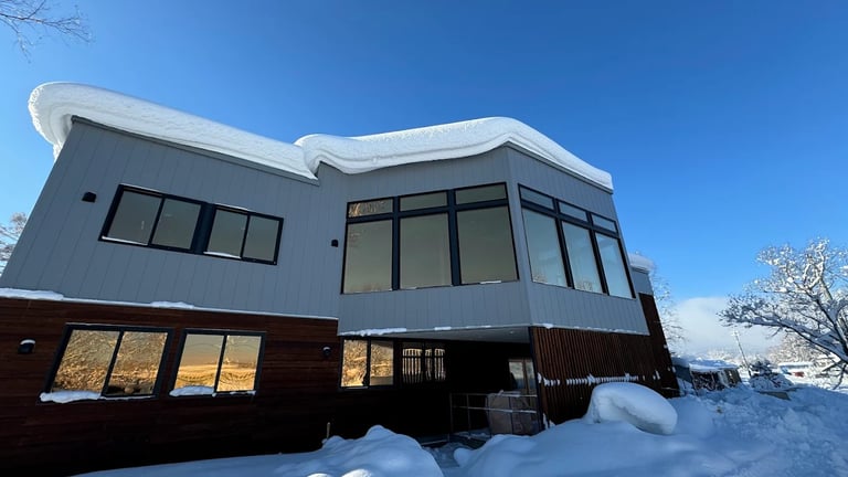 The modern architectural design of the KIU Academy Niseko campus facility.