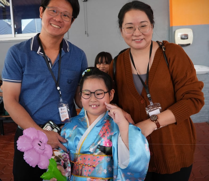 Family visits student at school’s Cultural Festival.