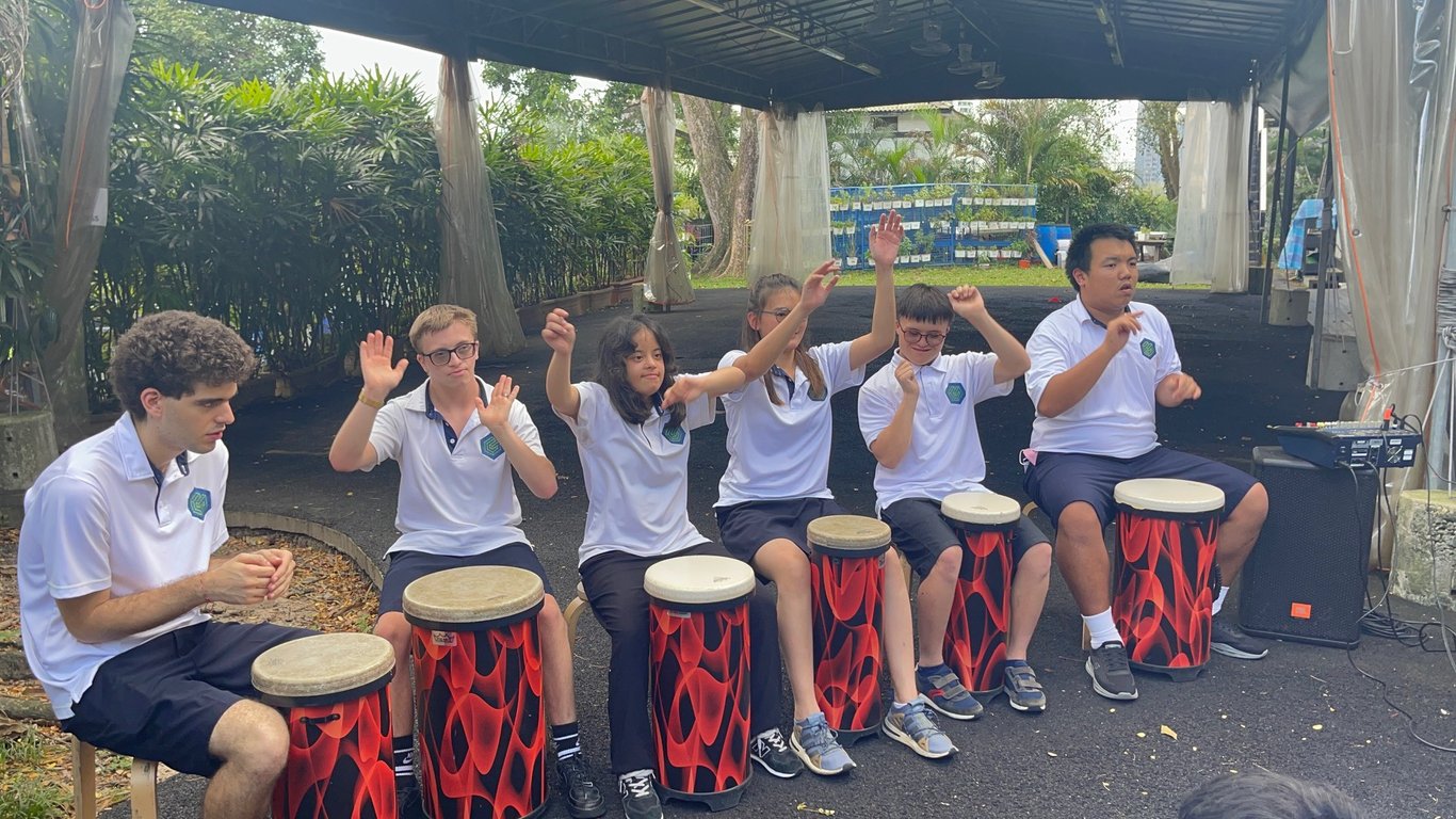 Students drumming in a co-curricular activity