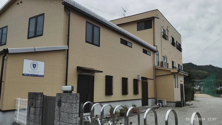 The main campus building of Kansai Christian School on a quiet afternoon.