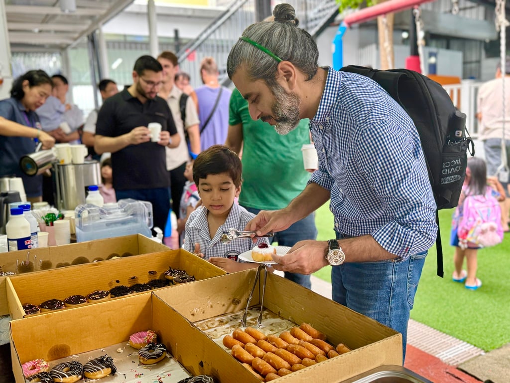 A father along with their child at the Father's day celebration event.