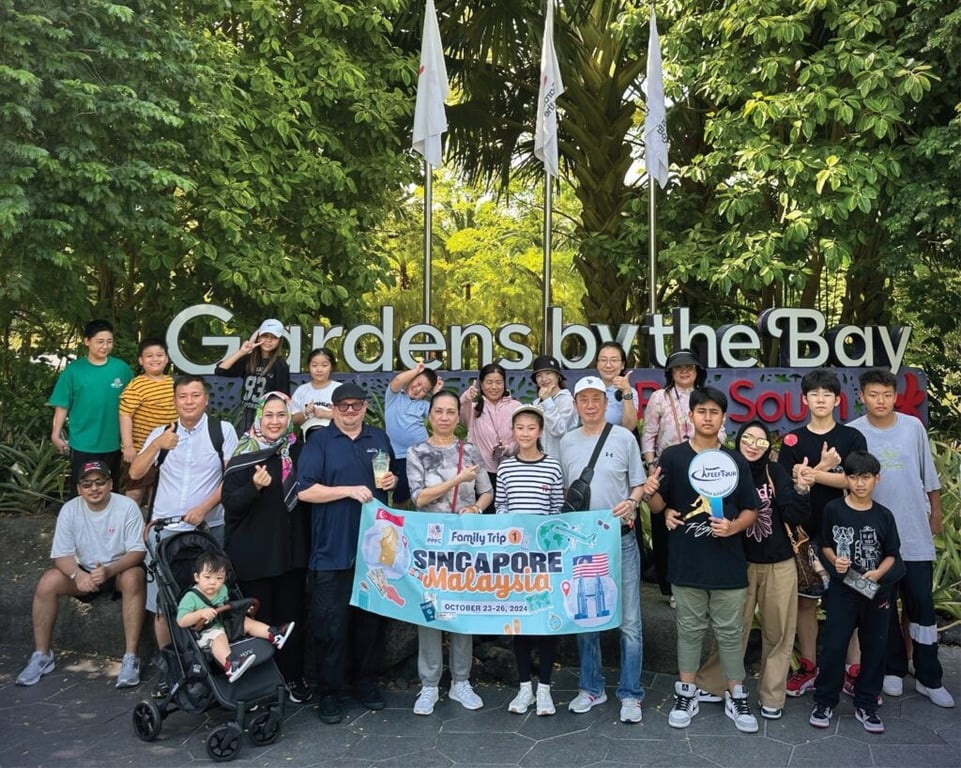 PAIS parents and students pose at Gardens by the Bay on a families trip.