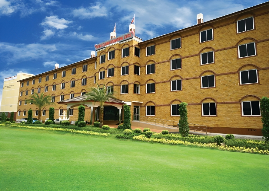 School campus view with spacious green surroundings.