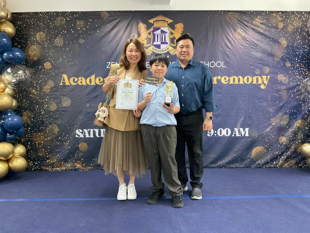 Families sharing joy as students receive their academic awards.