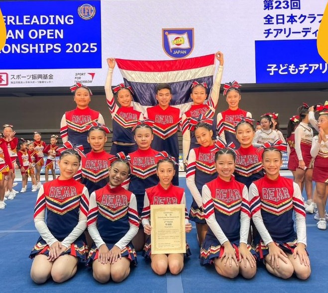 Cheerleading team representing the school at a Japan open event.