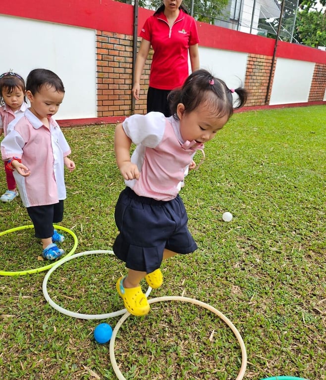 Children outside navigating obstacle courses, and enjoying various fun activities