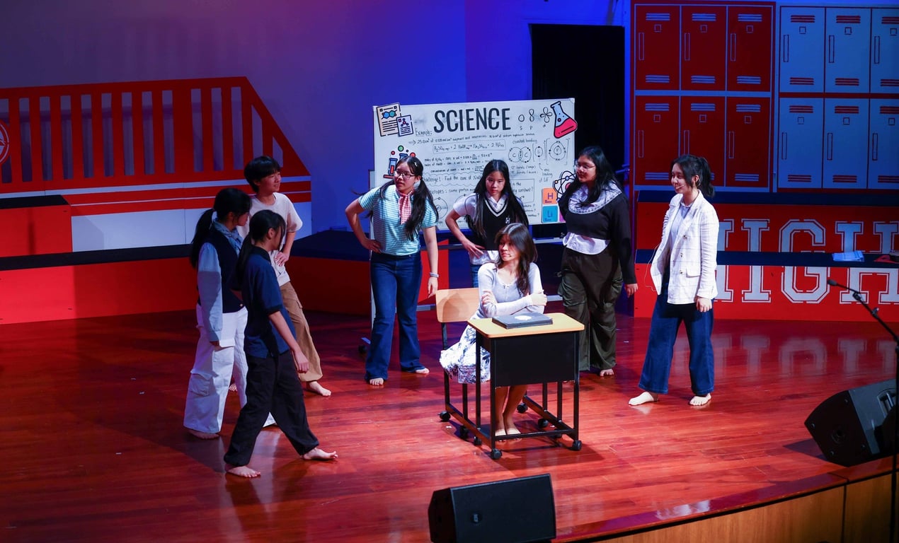 Students stage a lively science-themed performance.