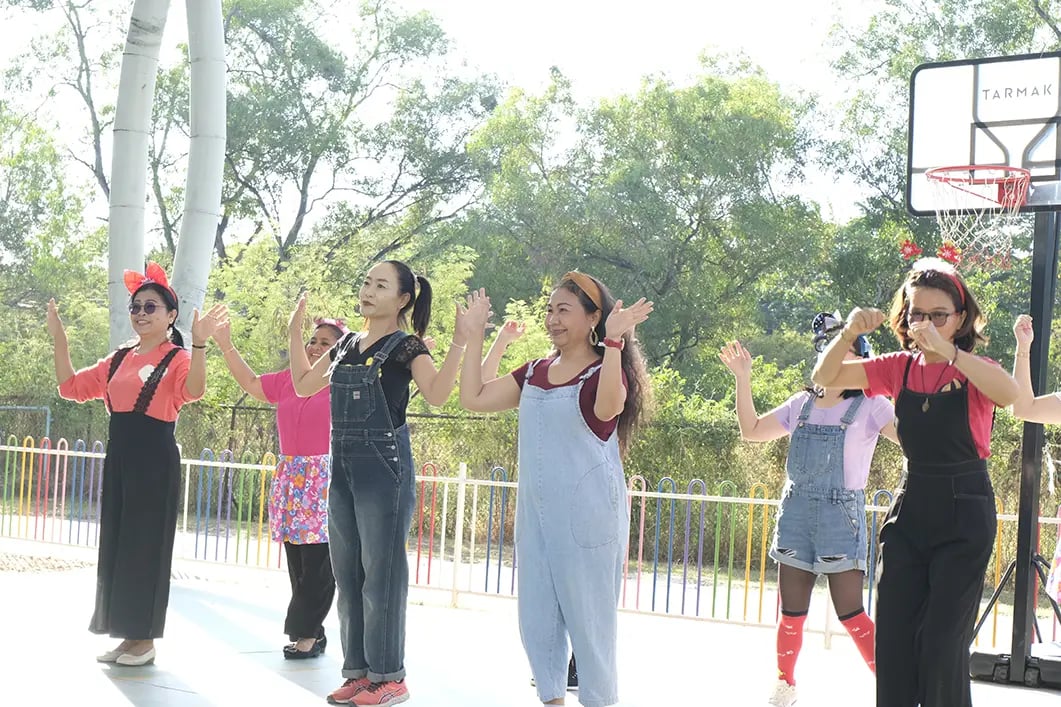 The AITIS community performing for students at the children's day event.