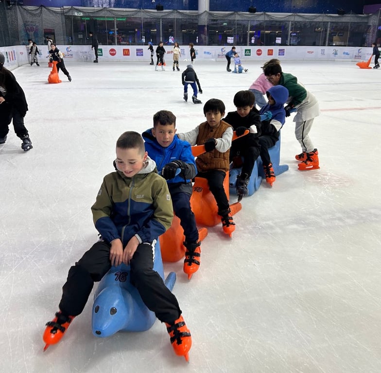 Grade 2–6 students enjoying ice skating together at Mega Bangna.