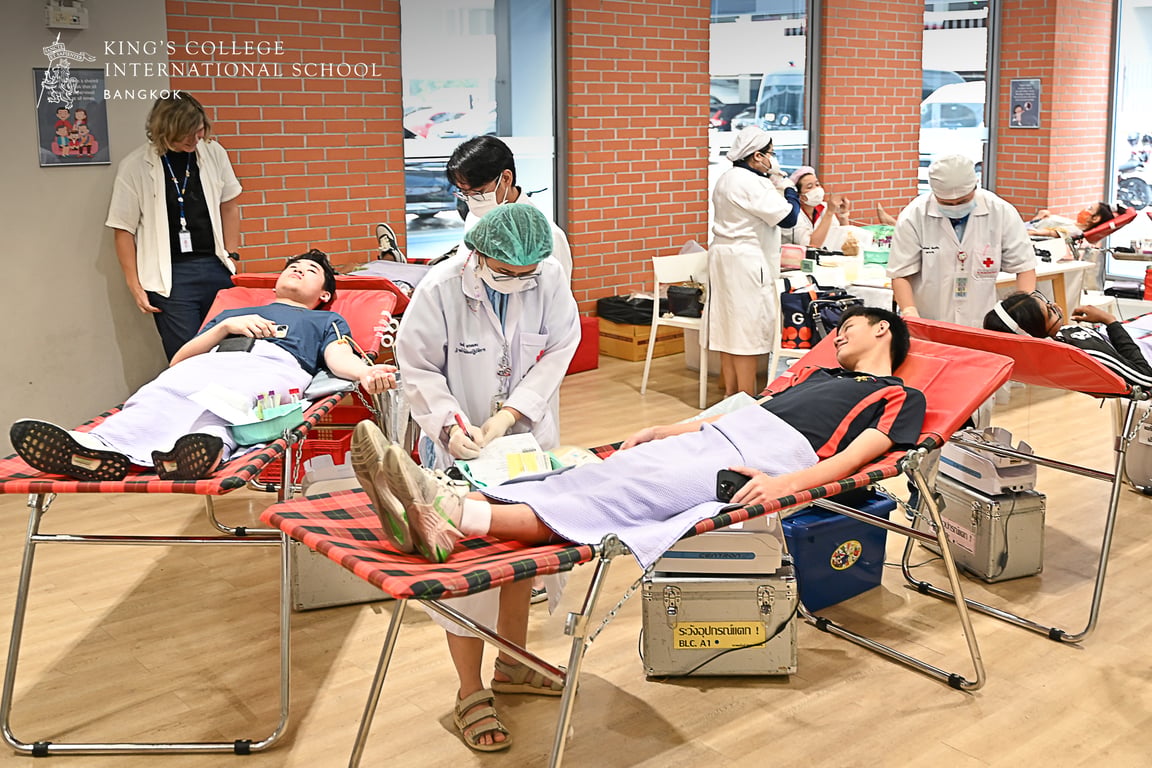 Volunteers giving blood at the school’s donation session.