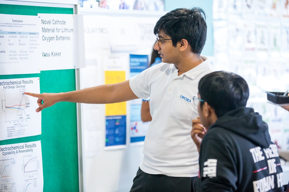 High school students presenting their work at the Science Fair