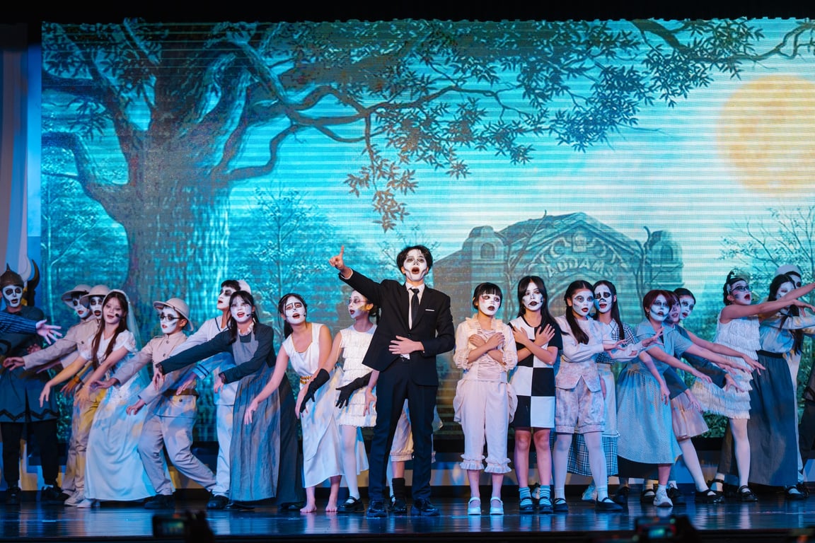 Secondary students performing The Addams Family on the BVIS Hanoi stage.