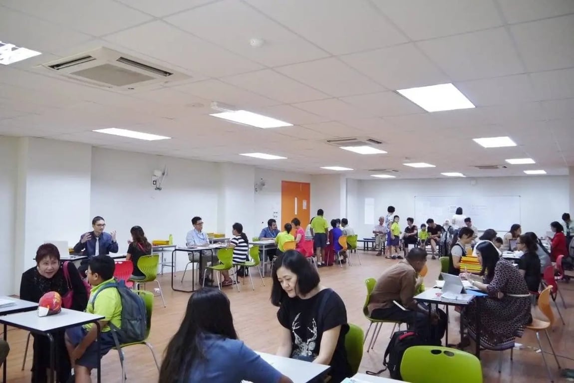 Parents and teachers meeting for student progress discussions