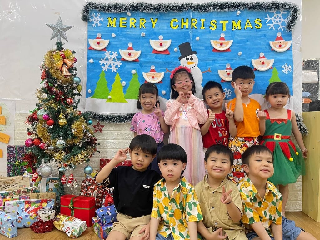 A group of students posing for a picture during Christmas celebration.
