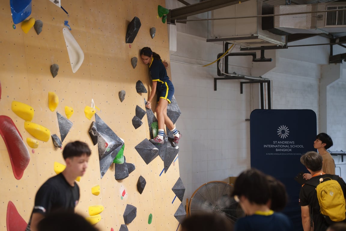 Student climbing during the inter-school bouldering competition.