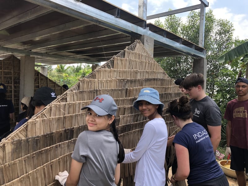Grade 11 students worked to build bamboo houses in Kompheim village in Cambodia as part of their Global Action Program (GAP) trip.