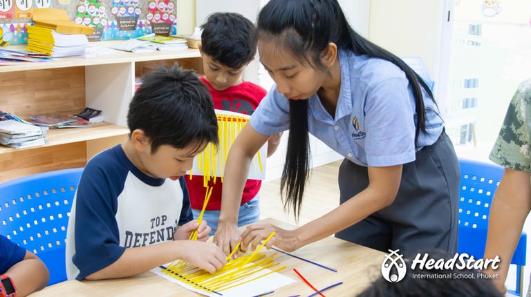 Students in the Thai Culture Club learning traditional Isaan bamboo weaving.