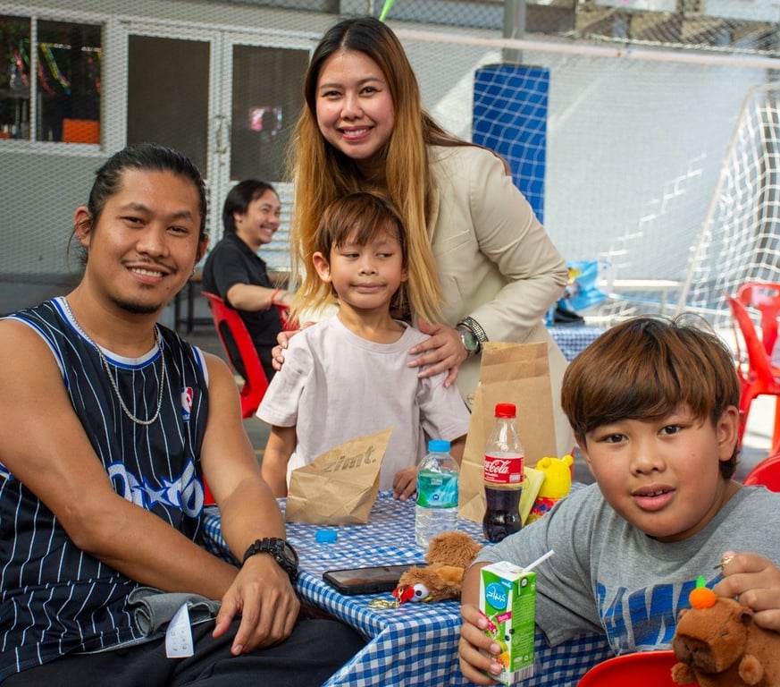 Families enjoying refreshments at a school community event.