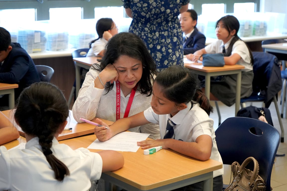 Parents and students in class participating in activities.